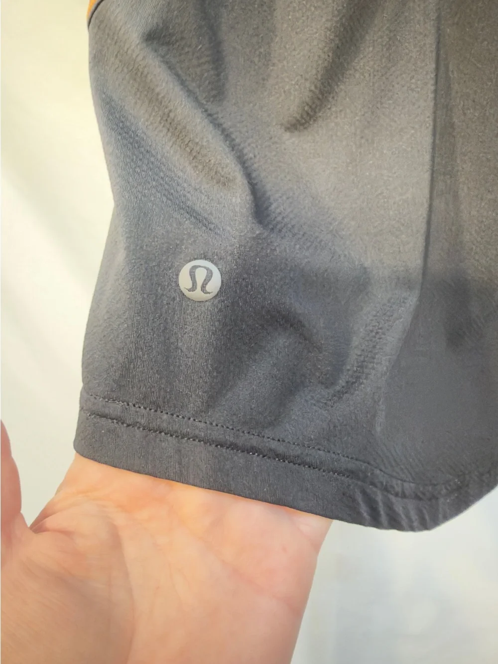 Lululemon Ventilated Open-Back Training T-Shirt in Black with Orange Soda trim